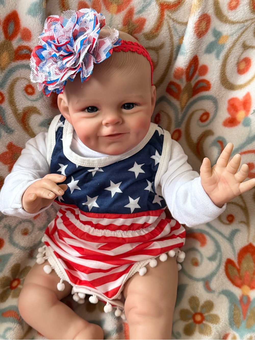 Realistic Baby Girl Doll in Pink Plaid Outfit with White Headband